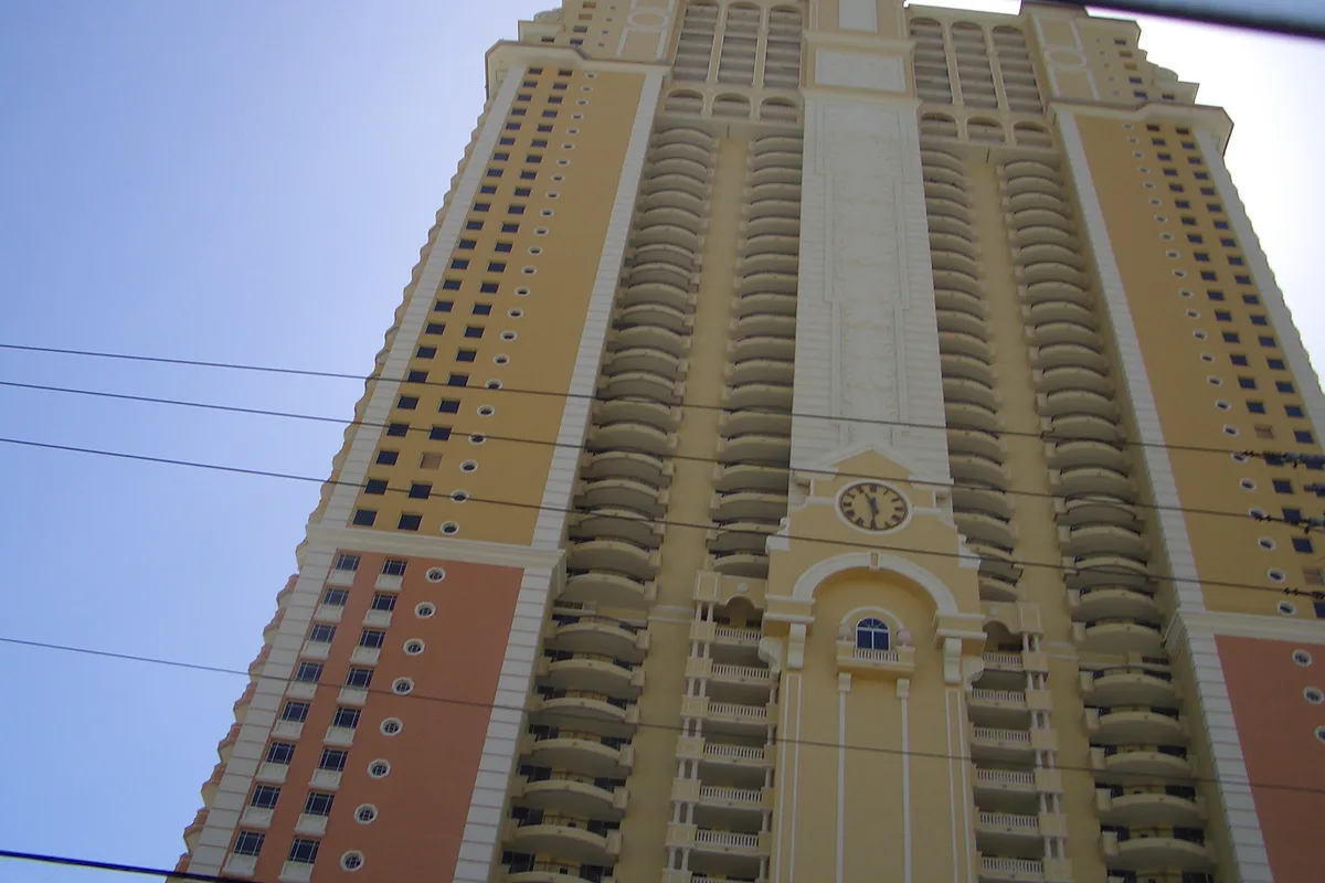 Upward view of the Acqualina facade with its clock and curved balconies, Sunny Isles Beach