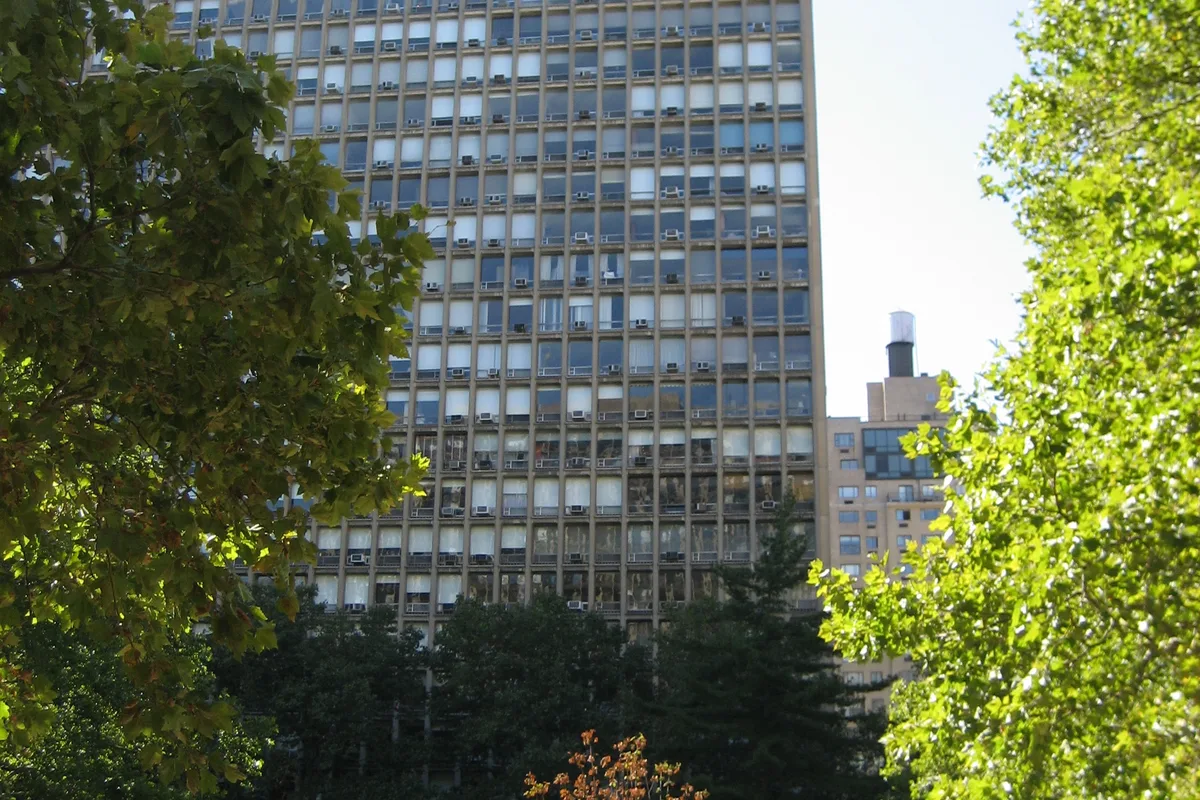 A Kips Bay Towers tower rising above the trees of the private residents' garden