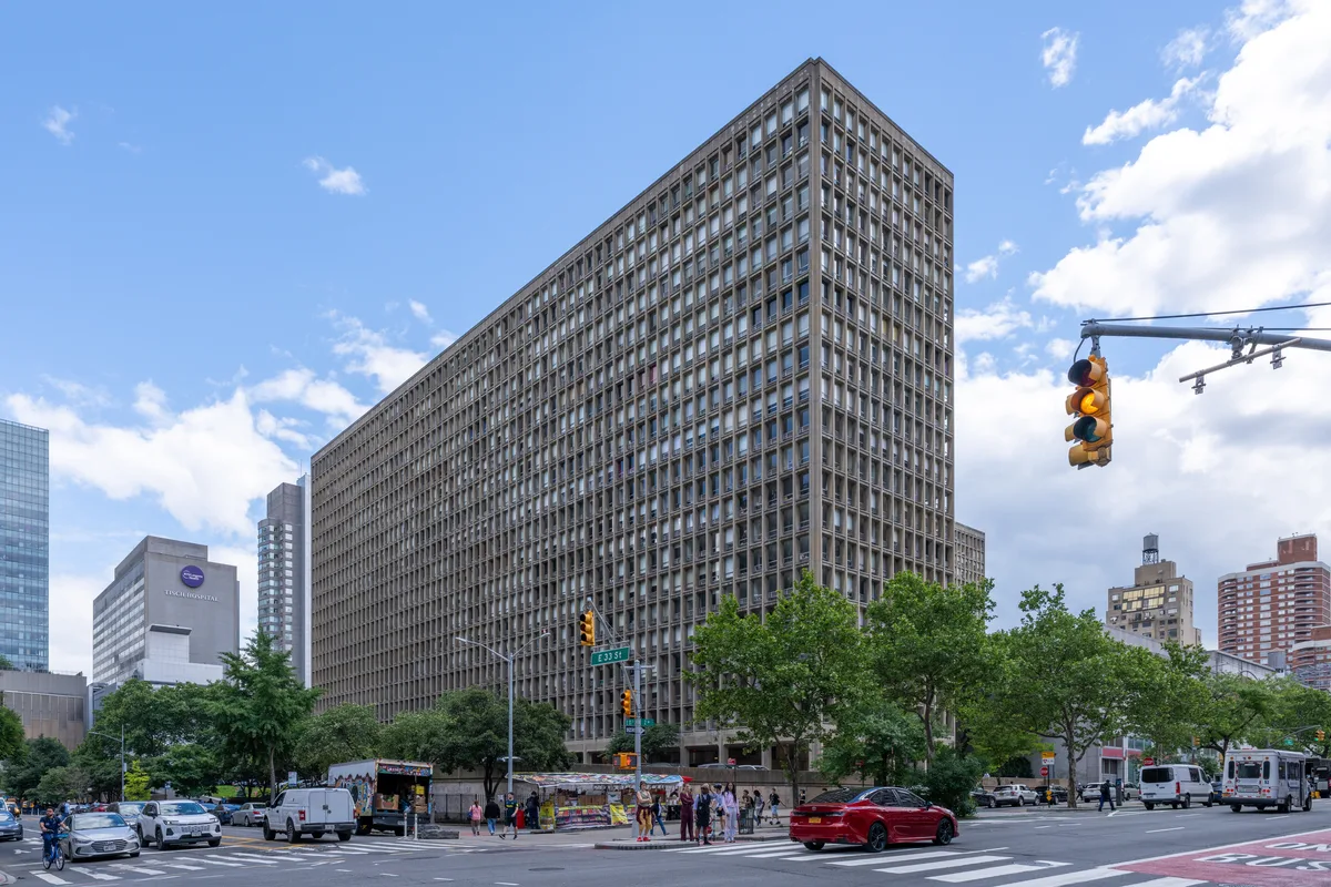 The north tower of Kips Bay Towers from First Avenue and East 33rd Street, with its grid of deep-set concrete windows
