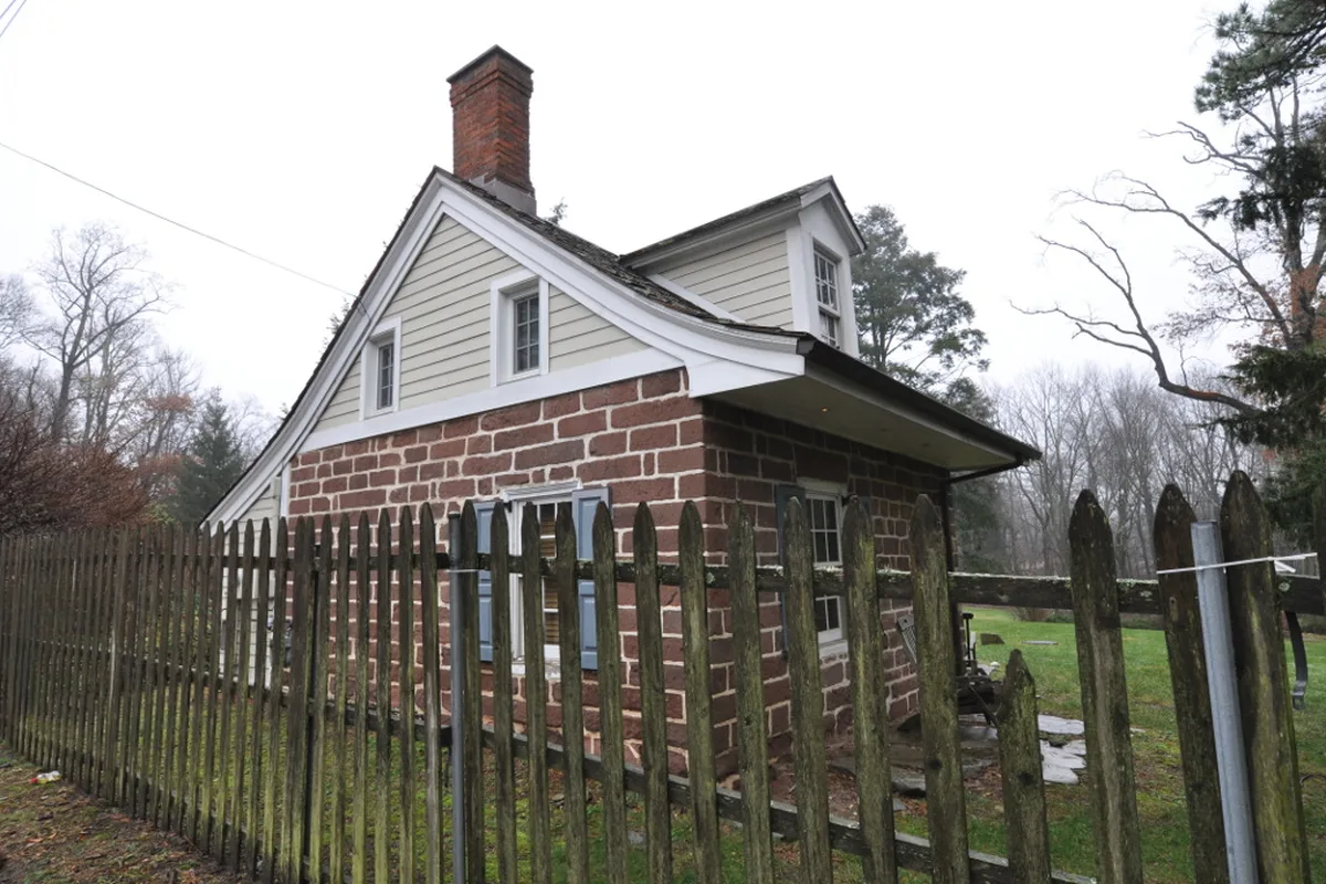 The surviving brownstone wing of the historic Achenbach House in Saddle River, a short distance west of the community (not the building/community)