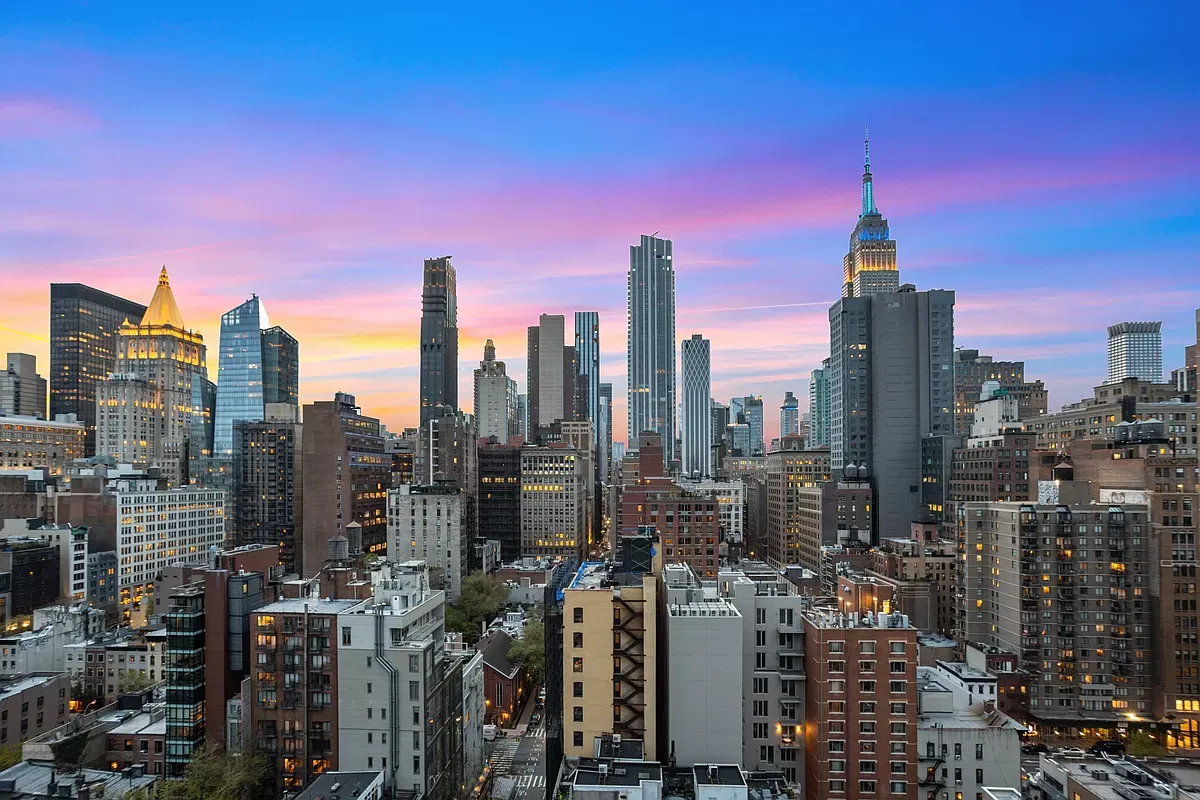 Dusk view of the Manhattan skyline and the Empire State Building from a high floor at The Bentley