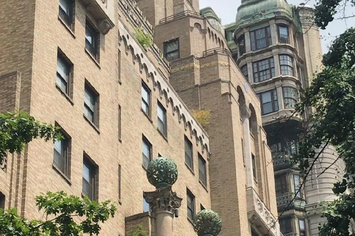 The Level Club's setback towers and bronze globes on West 73rd Street