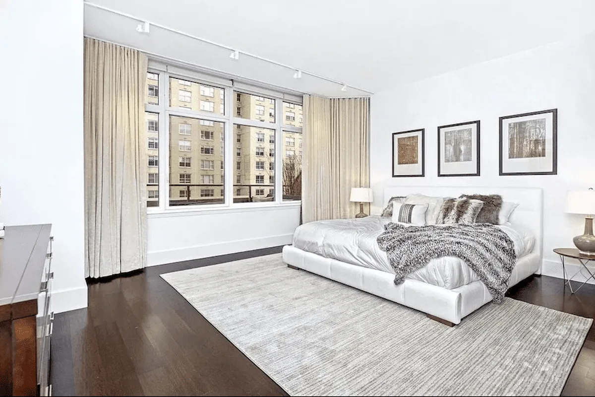 Bedroom in a Milan condominium apartment with floor-to-ceiling windows