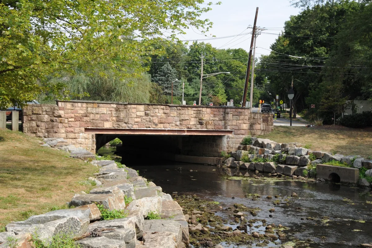 The 1875 stone Hardenburgh Avenue Bridge over Tenakill Brook in Demarest, not the building/community