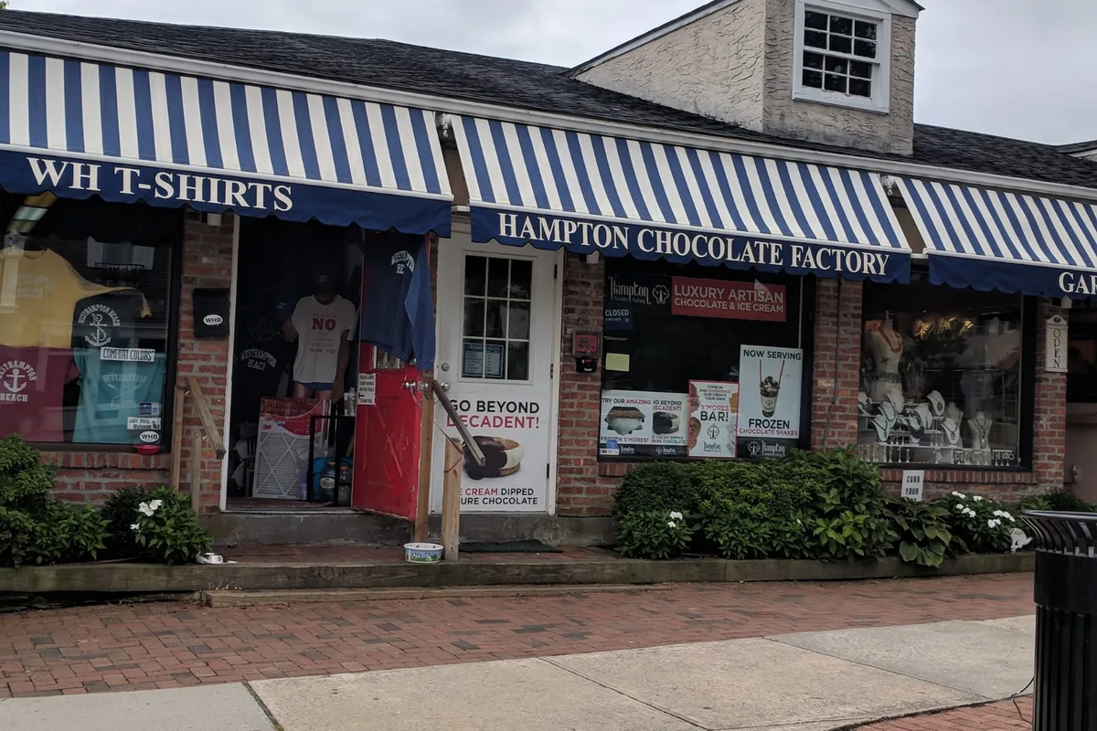 Shops under striped awnings on Main Street in Westhampton Beach