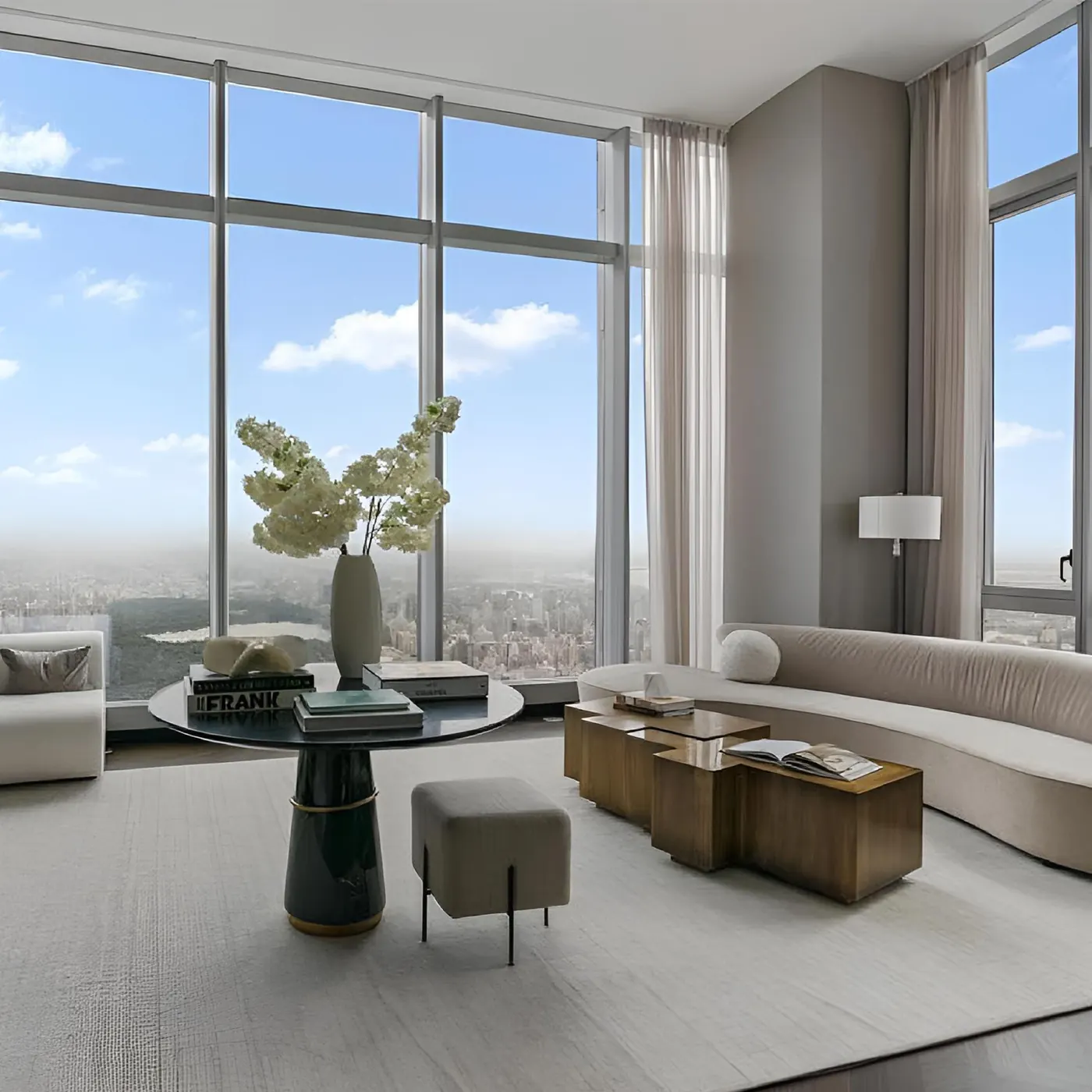 A high-floor luxury condo living room with floor-to-ceiling windows over Central Park and the Manhattan skyline